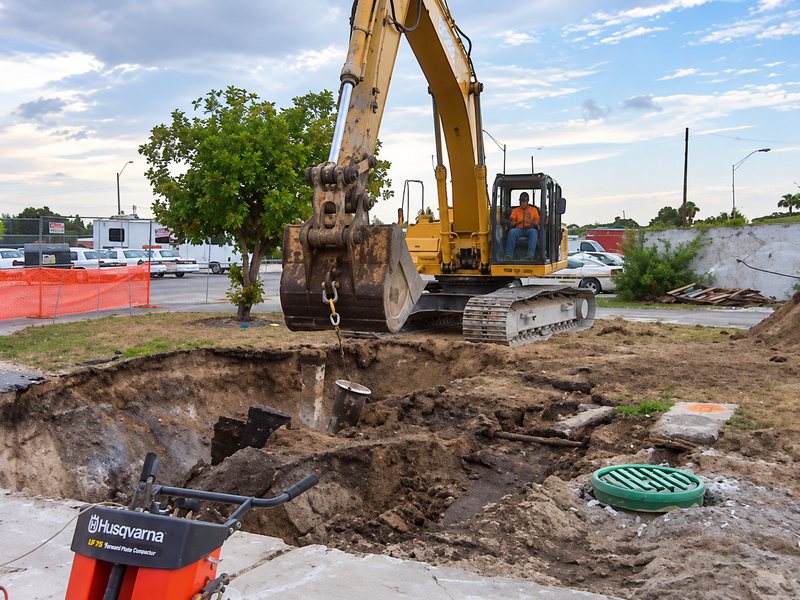 Excavator digging at the tank area