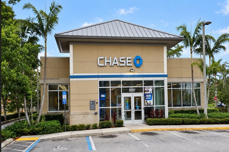 Bank branch building with landscaping and parking